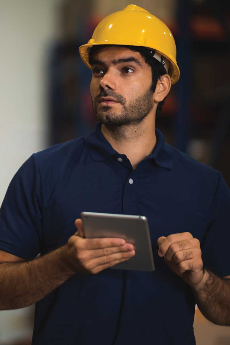 Male Employee Keeping the List of Fixtures and Counting Inventory in the Logistics Warehouse Responsible